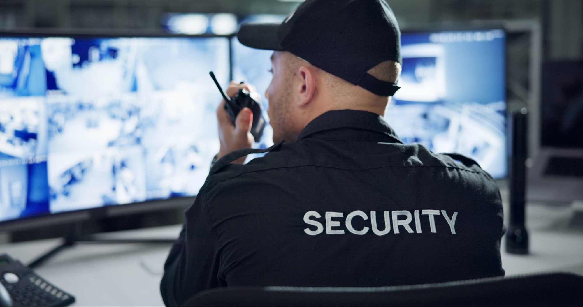 Security guard, walkie talkie and speaking by cctv monitor for protection, data center or building